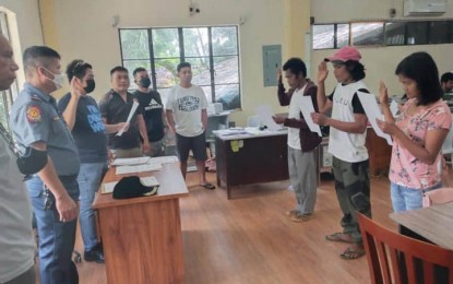 <p><strong>OATH OF ALLEGIANCE.</strong> Four New People's Army (NPA) rebels surrender Wednesday (Sept. 21, 2022) to government authorities in the provinces of Zamboanga del Sur and Zamboanga Sibugay. Three of the four NPA surrenderers (in photo) took their oath of allegiance before Mayor Gerry Paglinawan of Dumingag, Zamboanga del Sur, in a ceremony at the town hall on the same day.<em> (Photo courtesy of the Area Police Command-Western Mindanao)</em></p>