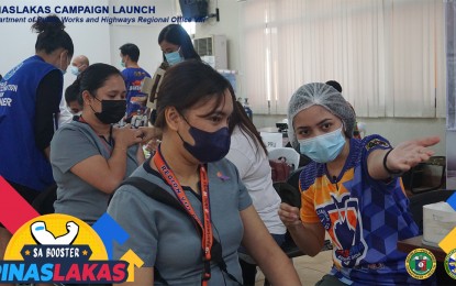 <p><strong>ANOTHER VAX SHOT</strong>. Employees of the Department of Public Works and Highways Eastern Visayas regional office receive booster shots in this Aug. 30, 2022 photo. At least 443,350 individuals in Eastern Visayas have received their first booster shots against Covid-19, or only 15.5 percent of the eligible population, prompting the Department of Health to renew its call to local government units to step up the vaccination drive. <em>(Photo courtesy of Department of Health Region 8)</em></p>