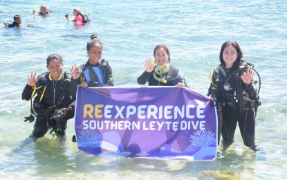 <p><strong>DIVE SPOT</strong>. Department of Tourism (DOT) Eastern Visayas regional director Karina Rosa Tiopes (2nd from right) joins divers during the relaunch of Southern Leyte Dive Spots in this March 22, 2022 photo. The DOT has asked local government officials in Southern Leyte to be active in gathering and providing tourism statistics in their localities. <em>(Photo courtesy of DOT)</em></p>
