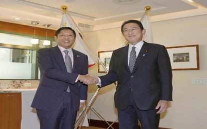 <p>Japanese Prime Minister Fumio Kishida (R) and Philippine President Ferdinand Marcos Jr. shake hands as they meet on Sept. 21, 2022, in New York. <em>(Kyodo)</em></p>
