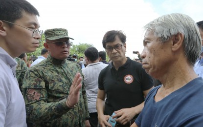 <p><strong>GUARDIANS.</strong> Philippine National Police chief Gen. Rodolfo Azurin Jr. and Interior Secretary Benjamin Abalos Jr. (2nd and 3rd from left) assure the protection of the Masungi Georeserve during their visit at the Baras, Rizal protected area on Friday (Sept. 23, 2022). Officials rushed to the site after receiving reports of vehicles with armed men encamping in the area. <em>(PNA photo by Joey Razon)</em></p>