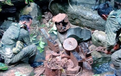 <p><strong>WEAPONS FOUND</strong>. Troops of the Philippine Army’s 94th Infantry Battalion at the site in Barangay Mahalang, Himamaylan City, Negros Occidental, where they discovered explosive devices and ammunition for .30-caliber machine gun on Thursday (Sept. 22, 2022). The area is an abandoned hideout of the Communist Party of the Philippines-New People’s Army. <em>(Photo courtesy of 94th Infantry Battalion, Philippine Army)</em></p>
