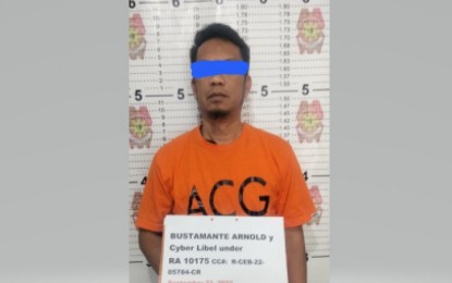 <p><strong>LIBEL SUSPECT</strong>. The Philippine National Police Anti-Cybercrime Group (PNP ACG) agents arrest Arnold Bustamante for alleged libelous remarks on Sept. 23, 2022. Bustamante was accused of defaming a business corporation’s product on his online radio program. <em>(Photo from PNP ACG)</em></p>