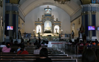 <p><strong>REFLECTION.</strong> Catholic devotees silently offer prayers at the Our Lady of the Most Holy Rosary of Manaoag in Pangasinan province on Sept. 24, 2022. The place is a famous pilgrimage site for devotees during the Holy Week, a must-visit site for local tourists before going to nearby beaches. <em>(PNA photo by Joey O. Razon)</em></p>