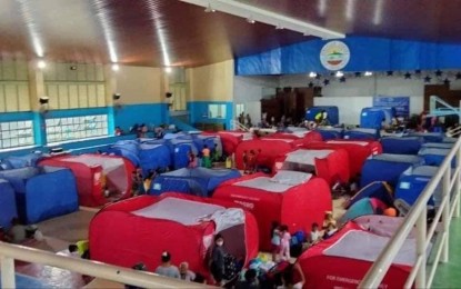 <p><strong>TEMPORARY SHELTER</strong>. Villagers affected by the onslaught of Super Typhoon Karding are temporarily staying at Dingalan Gymnasium in Dingalan, Aurora. A total of 13,467 residents in the entire province were brought to various evacuation centers.<em> (Photo by Jason de Asis)</em></p>