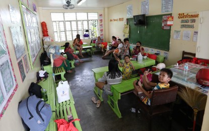 <p><strong>SCHOOL AS SHELTER. </strong>People stay in the classrooms of the Bagong Silangan Elementary School in Quezon City on Monday (Sept. 26, 2022). At least 1,800 evacuees stayed at the evacuation center. <em>(PNA photo by Joey O. Razon)</em> </p>