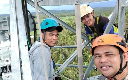<p><strong>FIXED.</strong> Globe Telecom technicians fix a misaligned antenna on a tower on Monday (Sept. 26, 2022) in Panukulan in the Polillo Group of Islands, among the areas worst hit by Super Typhoon Karding. Both Globe and PLDT-Smart continue to work on restoring network services in areas affected by the typhoon, with some areas already fully restored. <em>(Photo courtesy of Globe)</em></p>