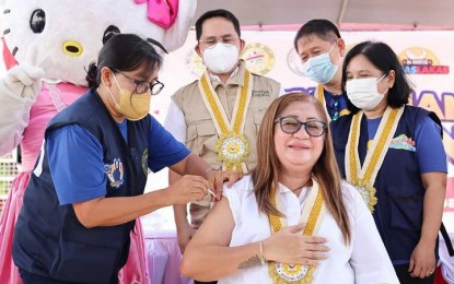 <p><strong>BOOSTED</strong>. Lezo, Aklan Mayor Mary Lenette Fernandez receives her booster dose during the launching of the Bakunahang Bayan: PinasLakas Special Vaccination Days at the town’s Hello Kitty Park on Tuesday (Sept. 27, 2022). The Department of Health regional office in Western Visayas is looking forward to increasing its vaccination coverage and reaching the target for the PinasLakas campaign covering the first 100 days of President Ferdinand Marcos Jr. <em>(Photo courtesy of DOH Western Visayas FB page)</em></p>