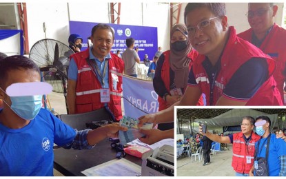 <p><strong>DSWD AID.</strong> Department of Social Welfare and Development Undersecretary Alan Tanjusay hands over cash to a decommissioned Moro Islamic Liberation Front combatant during the resumption of the Phase decommissioning process in Sultan Kudarat, Maguindanao on Tuesday (Sept. 27, 2022). Some 5,500 decommissioned MILF are set to receive the cash aid during the final phase of the decommissioning, expected to end in November this year. <em>(Photos courtesy of DSWD-12)</em></p>