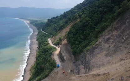 <p><strong>ROAD CLOSED</strong>. A section of the Manila North Road in Pagudpud, Ilocos Norte is rendered partially impassable due to a landslide in this undated photo. The Department of Public Works and Highways plans to build a rock shed over the road to protect it from debris and rockfall.<em> (DPWH Region 1)</em></p>