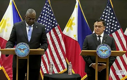 <p>US Defense Secretary Lloyd Austin (left) and Department of National Defense officer-in-charge Undersecretary Jose Faustino Jr. (right) <em>(Screengrab from US Department of Defense video)</em></p>