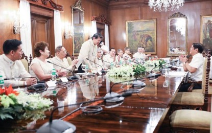 <p><strong>BOOSTING THE ECONOMY</strong>. President Ferdinand Marcos Jr. (right) meets with members of the Federation of Filipino Chinese Chambers of Commerce and Industry, Inc. (FFCCCII) at Malacañan Palace in Manila on Friday (Sept. 30, 2022) to discuss ways to speed up the country’s economic recovery from the pandemic. During the meeting, the FFCCCII pitched to Marcos its ideas to realize the administration’s bid to revitalize and transform the economy. <em>(Photo from PBBM’s official Facebook page)</em></p>