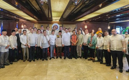 <p><strong>PEACEMAKERS.</strong> President Ferdinand Marcos Jr. (8th from left, front row) poses with members of the Bangsamoro Transition Authority Parliament after administering their oaths of office in Malacañang on Aug. 12, 2022. Marcos vowed the Executive Department will support the Bangsamoro peace process all the way. <em>(Courtesy of BBM Facebook)</em></p>