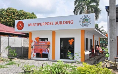 <p><strong>FUNERAL HOME.</strong> The first funeral home named "Lamayan ng Bayan," which offers an alternative for those who cannot afford funeral services for their loved ones, opens on Monday (Oct. 3, 2022) in Barangay Talomo, Davao City. Rodrigo Duterte II, the son of 1st District Rep. Paolo Duterte, leads the turnover of the building to barangay officials.<em> (Photo courtesy of Rep. Paolo Duterte's Office)</em></p>