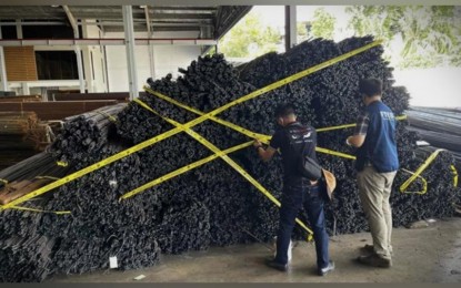 <p><strong>CRACKDOWN.</strong> The enforcement team of the Department of Trade and Industry (DTI) seals deformed bars in an establishment in Cebu as these products are found to be uncertified. The DTI boosts its market monitoring to ensure that only safe and reliable products are being sold in the market.<em> (Photo courtesy of DTI)</em></p>