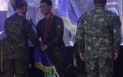 <p><strong>CHANGE OF COMMAND.</strong> Lt. Gen. Alfredo Rosario Jr., Western Mindanao Command (Westmincom) chief, hands over the Westmincom's command flag to Armed Forces chief of staff. Lt. Gen. Bartolome Vicente Bacarro (center), as he relinquished his post Tuesday (Oct. 4, 2022) to Brig. Gen. Arturo Rojas, Westmincom's deputy for external defense operations (right), who was selected to serve as acting commander of the unit. Rosario will retire as he will turn 56, the mandatory retirement age, on Wednesday (Oct. 5, 2022). <em>(Photo by Teofilo P. Garcia, Jr.)</em></p>