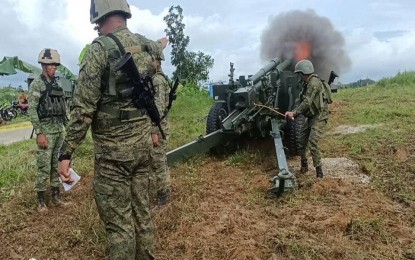 <p><strong>SHARPENING SKILLS.</strong> Philippine Army Artillery Regiment personnel fire a 105mm. howitzer during the series of artillery drills in Barangay Dung-e, Sipalay City, Negros Occidental on Tuesday (Oct. 4, 2022). The series of registration and live-fire drills aims to improve the Army gunners’ skills and accuracy. <em>(Photo courtesy of Philippine Army)</em></p>