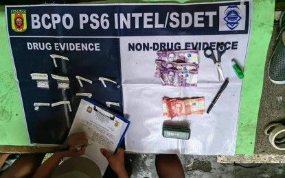 <p><strong>DRUGS SEIZED</strong>. An operative of Bacolod City Police Office Station 6 Drug Enforcement Team conducts an inventory of the shabu recovered during a buy-bust at Purok Cadena de Amor, Barangay 29 on Sept. 28, 2022. Suspect Marciano Marchan yielded 15 grams of the prohibited substance worth PHP102,000. <em>(Photo courtesy of Bacolod City Police Office)</em></p>