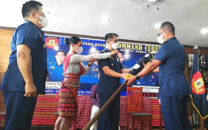 <p><strong>TURNOVER.</strong> Police Regional Office-Cordillera assistant regional director for administration Brig. Gen. John Chua (center) administers the turnover of command at the Baguio City Police Office (BCPO) on Wednesday (Oct. 5, 2022). Col. Francisco Bulwayan (right) receives the flag representing the responsibility that goes with the position from Col. Glenn Lonogan who served for one year and three months.<em> (PNA photo by Liza T. Agoot)</em></p>