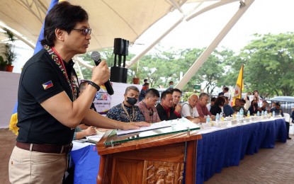 <p><strong>AID TO EX-REBELS.</strong> Interior and Local Government Secretary Benjamin Abalos Jr. leads the distribution of Enhanced Comprehensive Local Integration Program (E-CLIP) assistance to 199 former rebels in a ceremony on Oct. 5, 2022, in Patin-ay, Prosperidad, Agusan del Sur. Each former rebel received immediate livelihood assistance, as well as aid for their reintegration from E-CLIP program.<em> (PNA photo by Alexander Lopez)</em></p>