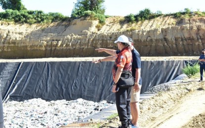 <p><strong>NEW SANITARY LANDFILL</strong>. Mayor Michael Keon inspects the new sanitary landfill in Barangay Balatong, Laoag City on Tuesday (Oct. 4, 2022). The new sanitary landfill will now be the dumping site for the city's residual wastes. <em>(Photo courtesy of Alwyn Formantes, City Government of Laoag)</em></p>