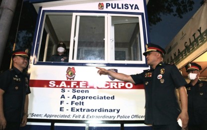 <p><strong>ROLLING OUTPOST.</strong> NCRPO Chief, Brig. Gen. Jonnel Estomo (right), inspects the third mobile police outpost deployed along Diosdado Macapagal Boulevard in Barangay Tambo, Parañaque City on Monday (Oct. 3, 2022). The mobile outpost sustains genuine police visibility where patrollers are on standby and ready to assist the public in times of emergencies and extend safety services as the need arises. <em>(Photo courtesy of NCRPO)</em></p>