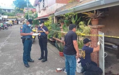 <p><strong>TEACHER KILLED</strong>. Members of the Police Scene of the Crime Operatives examine the boarding house in Basey, Samar where a public school teacher was stabbed to death by a former student on Oct. 3, 2022. The Department of Education said it is saddened by the "tragic incident."<em> (Photo courtesy of Basey police station)</em></p>