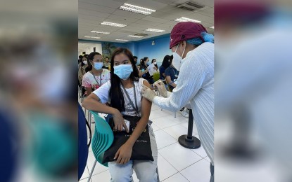 <p><strong>INOCULATED</strong>. A business process outsourcing firm employee gets vaccinated against Covid-19 at their workplace in Bacolod City in September. On Thursday (Oct. 6, 2022), the city government urged residents to already avail themselves of the initial doses and booster shots amid limited vaccine supply. <em>(Photo courtesy of the Bacolod City Health Office)</em></p>