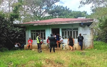 <p><strong>ILLEGAL OCCUPATION.</strong> Security guards, acting on behalf of a private person, occupy on Oct. 4, 2022 the old Bureau of Plant and Industry (BPI) building inside the Baguio Animal Breeding and Research Center (BABRC) facility. The Baguio City Police Office has filed charges for trespassing and illegal possession of firearms against them for illegally entering the government facility without authority. <em>(PNA photo courtesy of DA-CAR)</em></p>