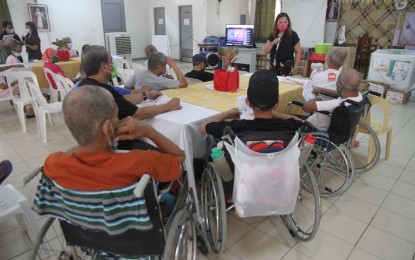 <p><strong>FOR THE ELDERLY</strong>. News and Information Bureau (NIB) assistant director Lee Ann Pattugalan leads the distribution of goods donated by NIB personnel during their outreach program at the Golden Reception and Action Center for the Elderly and other Special Cases (GRACES) in Quezon City on Thursday (Oct. 6, 2022). GRACES envisions providing a friendly and home-like atmosphere to vulnerable, disadvantaged, and marginalized senior citizens.<em> (PNA photo by Rico H. Borja)</em></p>