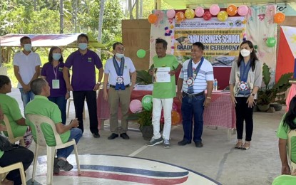 <p><strong>SKILLS ENHANCEMENT.</strong> A member of the Kapate Agrarian Reform Beneficiaries and Farmers Association in Kiamba, Sarangani receives his certificate of completion from the Farm Business School in this undated photo. The Department of Agrarian Reform conducted the 12-week course aimed at developing the management abilities and entrepreneurial mindset of farmers. <em>(Courtesy of DAR)</em></p>