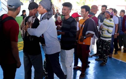 <p><strong>PEACE PACT.</strong> Two warring clans led by Sata Mukahil and Hamid Muhammad of Tabuan Lasa, Basilan province inked a peace pact on Wednesday (Oct. 5, 2022), ending their five-year-old dispute. The signing of the pact was initiated by the provincial and municipal governments, as well as military and police authorities in the area.<em> (Photo courtesy of the Army's 4th Special Battalion)</em></p>
