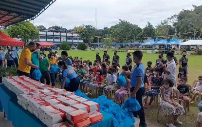 <p><strong>GIFT-GIVING</strong>. The Police Regional Office 6 (Western Visayas) treats 100 children from barangays Veterans Village and Concepcion in City Proper to gift-giving, parlor games, and feeding activities as part of the activities for its “Fiesta sa Kampo 2022” on Friday (Oct. 7, 2022). The celebration also gathered representatives of various offices and units inside the regional headquarters for the “Laro ng Lahi” aimed at reviving traditional games. <em>(Contributed photo)</em></p>