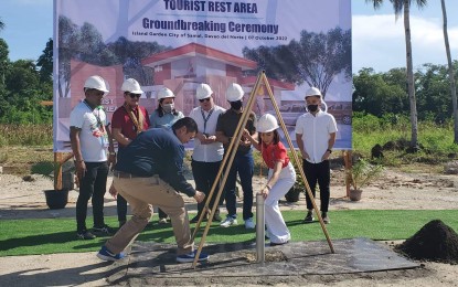 <p><strong>BREAKING GROUND.</strong> Tourism Secretary Christina Garcia Frasco leads the embedding of the capsule during the groundbreaking ceremony of the Tourist Service Center and Rest Area (TSCRA) in Barangay Peñaplata, Samal City, Davao del Norte on Friday (Oct. 7, 2022). The tourist pit stop will have an information kiosk, pasalubong center, restrooms, and resting space for visitors. <em>(PNA photo by Che Palicte)</em></p>