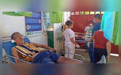 <p><strong>BLAST VICTIM</strong>. Motorcycle mechanic Reformido Regulacion, 64, (left) sustained shrapnel injuries on his thighs and lower legs after a man tossed a hand grenade at his motorbike shop in Pikit, North Cotabato on Friday (Oct. 7, 2022). Another victim, identified as Abdulrauf Mustapha Pangatong, 29, was injured in the same attack. <em>(Photo courtesy of Pikit MPS)</em></p>