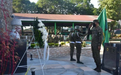 <p><strong>DEATH ANNIVERSARY.</strong> Maj. Gen. Ignatius Patrimonio, Army’s 11th Infantry Division (right), renders a salute to the statue of the late Brig. Gen. Teodulfo Bautista, then commander of the 1st Infantry Division, as they commemorate Monday (Oct. 10, 2022) the 45th death anniversary of the respected military leader. Bautista was among the 35 officers and men of the Philippine Army who were killed by elements of the Moro National Liberation Front under Usman Sali on Oct. 10, 1977 at the public market in Barangay Danag, Patikul, Sulu.<em> (Photo courtesy of 11ID)</em></p>