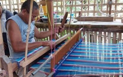<p><strong>LOOM WEAVING</strong>. The Bagtason Loomweavers Association (BLWA) trains a male loom weaver. BLWA chairman Mario Manzano said on Monday (Oct. 10, 2022) men are encouraged to engage in loom weaving as source of livelihood. <em>(PNA photo courtesy of Mario Manzano)</em></p>