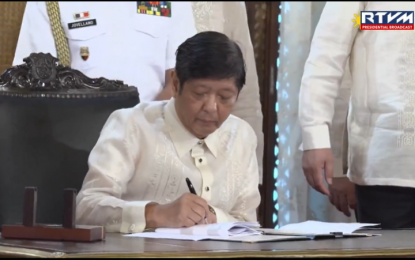 <p>President Ferdinand "Bongbong" Marcos Jr. signs Republic Act No. 11934 also known as An Act Requiring the Registration of SIM Cards. <em>(Screencapture of RTVM video)</em></p>