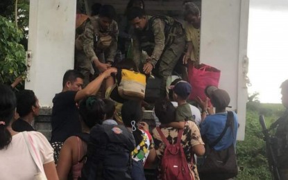 <p><strong>EVACUATION</strong>. Residents of Barangay Carabalan, Himamaylan City, Negros Occidental evacuate on Oct. 9, 2022 following a series of firefights between government troops and New People's Army rebels that started on Oct. 6. As of Wednesday, more than 18,000 residents have sought shelter in various evacuation centers.<em> (Photo courtesy of Himamaylan City Social Welfare and Development Office)</em></p>