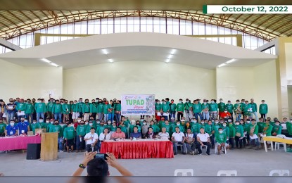 <p><strong>CASH FOR WORK.</strong> Agusan del Norte's first district Rep. Jose Aquino II (sitting 4th from left) joins the distribution of the PHP721,000 TUPAD program payout on Wednesday (Oct. 12, 2022) in Las Nieves, Agusan del Norte. Some 154 beneficiaries from the different barangays got their payments from the community services they rendered through the program of the Department of Labor and Employment. <em>(Photo courtesy of Las Nieves LGU)</em></p>