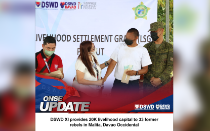 <p><strong>LIVELIHOOD AID.</strong> A former New People’s Army (NPA) member (2nd right) receives the PHP20,000 cash aid from the Department of Social Welfare and Development - Davao Region Director Vanessa Goc-ong (2nd left) on Wednesday (Oct. 12, 2022) in Malita, Davao Occidental as livelihood assistance to start a new life with his family. A total of 33 former rebels received the same assistance under the DSWD's Sustainable Livelihood Program.<em> (Photo courtesy of DSWD-11)</em></p>