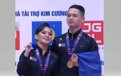 <p><strong>PERFECT COMBINATION</strong>: Ana Leonila Nualla and Sean Mischa Aranar at the podium during the dancesport awarding ceremony at the 2022 Vietnam SEA Games. The pair won three gold medals coming from the Standard Viennese Waltz, Tango and All Five Dances events. <em>(Contributed photo)</em></p>