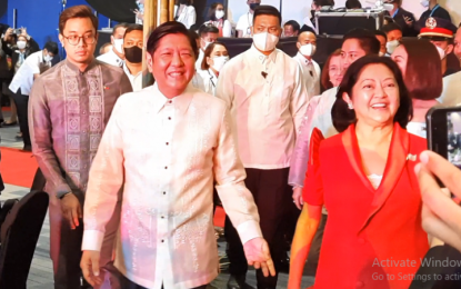 <p><strong>REVIVAL OF TOURISM</strong>. President Ferdinand “Bongbong” Marcos Jr. and First Lady Liza Araneta-Marcos arrive at the SMX Convention Center in Pasay City to grace the Philippine Tourism Industry Convergence Reception (PTICR) on Monday (Oct. 17, 2022). Marcos, in his speech, said fresh ideas are needed to help revive tourism from the impact of the Covid-19 pandemic. <em>(Screengrab from PNA video)</em></p>
