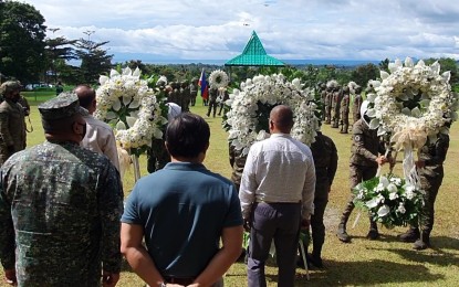 <p><strong>FULL HONORS.</strong> Brig. Gen. Arturo Rojas (left) is joined by Marawi City Mayor Majul Gandamra at the 103rd Infantry Brigade headquarters on Monday (October 17, 2021) in a wreath-laying ceremony. The activity formed part of the 5th year commemoration of the fallen soldiers and liberation of the city after its five-month siege from the Daesh-inspired Dawlah Islamiya group in 2017.<em> (PNA photo by Nef Luczon)</em></p>