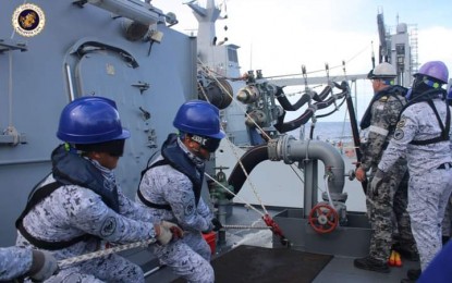 <p><strong>REPLENISHMENT-AT-SEA.</strong> Crew members of the Philippine Navy's BRP Jose Rizal participate in the replenishment at sea (RAS) evolution, which is part of the Maritime Training Activity "Samasama-Lumbas" 2022 off the waters of Negros Oriental on Oct. 16, 2022. The RAS or the capability to refuel while at sea is considered one of the hallmarks of a modern navy.<em> (Photo courtesy of Naval Forces Central)</em></p>
