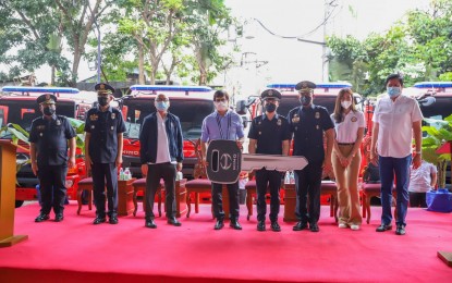 <p><strong>BOOSTING FIRE RESPONSE.</strong> DILG Secretary Benjamin Abalos Jr. (center) leads the turnover of the ceremonial key for the 35 fire trucks to select LGUs at the BFP national headquarters in Quezon City on Tuesday (Oct. 18, 2022). Abalos said the acquisition of the fire trucks is part of the BFP's modernization program to meet the ideal ratio of one fire truck for every city or municipality.<em> (Photo courtesy of DILG)</em></p>