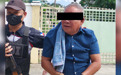 <p><strong>ANCESTRAL DOMAIN.</strong> Barangay Kapatagan village chief Juanito Morales in Digos City, Davao del Sur, is arrested by the National Bureau of Investigation in Davao Region on Oct. 15, 2022 after allegedly being caught in the act of signing documents selling a portion of land within the ancestral domain that is prohibited by law. Morales is an ex-officio member of the Digos City Council, representing the Liga ng Barangay of Digos City.<em> (Photo courtesy of One Mindanao)</em></p>