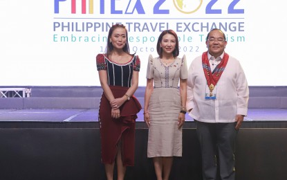<p>Tourism Promotions Board of the Philippines Chief Operating Officer Margarita Nograles, Tourism Secretary Christina Frasco, and Rep. Eleandro Jesus Madrona during the opening of the 2022 PHITEX at Marriott Hotel, New World Resorts on Wednesday (Oct. 19, 2022). <em>(Photo courtesy of TPB)</em></p>