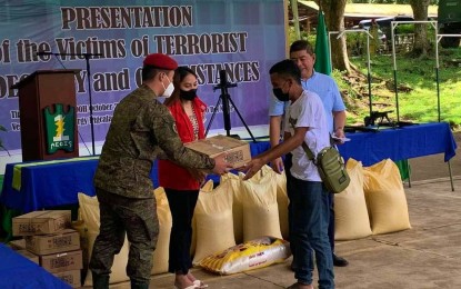 <p><strong>FOOD AID</strong>. A member of BIFF receives a food pack from military and local officials in Maguindanao and North Cotabato provinces after he and 12 others surrendered to the government Wednesday (Oct. 19, 2022). The surrenderers are part of the BIFF-Bongos faction operating in the adjoining provinces.<em> (Photo courtesy of 6ID)</em></p>