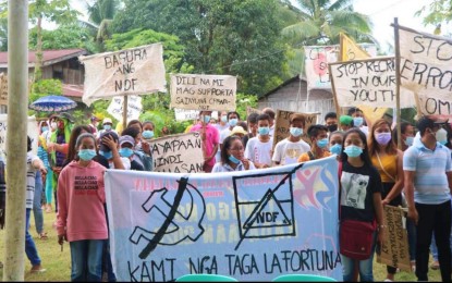 <p><strong>DENOUNCING NPA</strong>. Former rebel mass support group members in Barangay La Fortuna of M’lang town hold a protest rally Tuesday (Oct. 18, 2022) against the presence of the communist New People’s Army in other parts of North Cotabato province. M’lang and neighboring town Matalam are the first  local government units declared as insurgency-free in the province by their respective municipal councils. <em>(Photo courtesy of 90IB)</em></p>